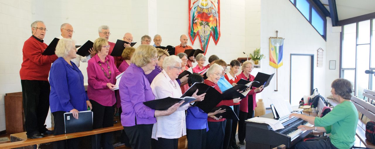 Choir and pianist in church sanctuary